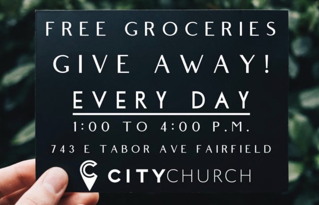 Flyer for a free groceries giveaway event.